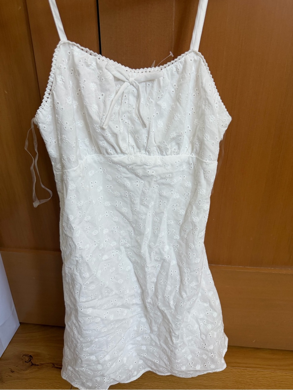 White Eyelet Cami Dress 
Girls large equivalent to a size 12 girls